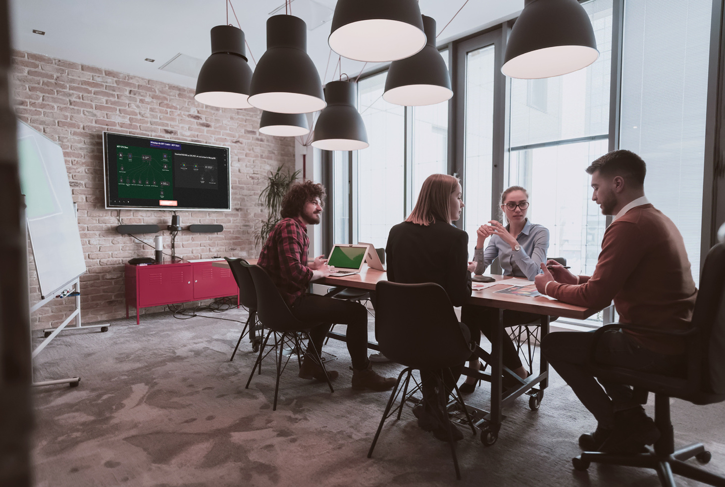 Team members collaborating during a Bridgeware Technologies AI upskilling session